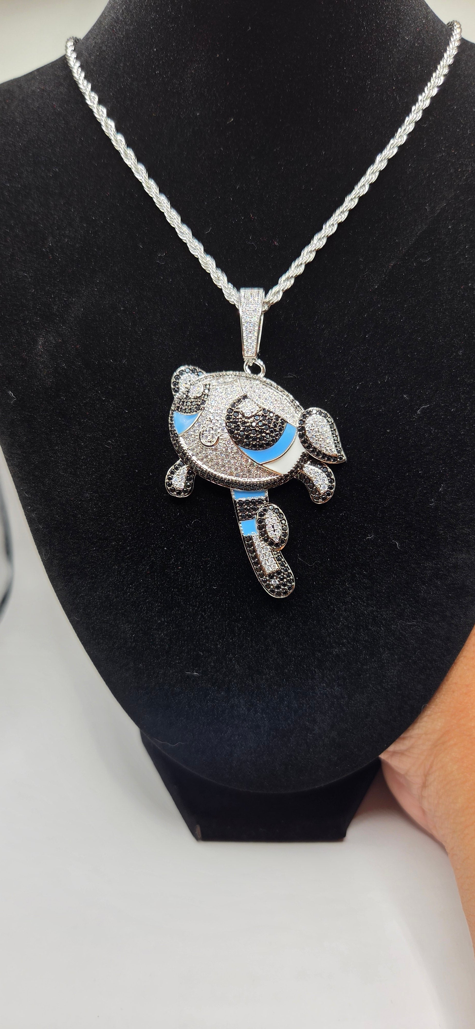Iced out Bubbles power puff girl pendant on a 24 inch rope chain.
