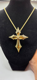 Golden colored cross and chain