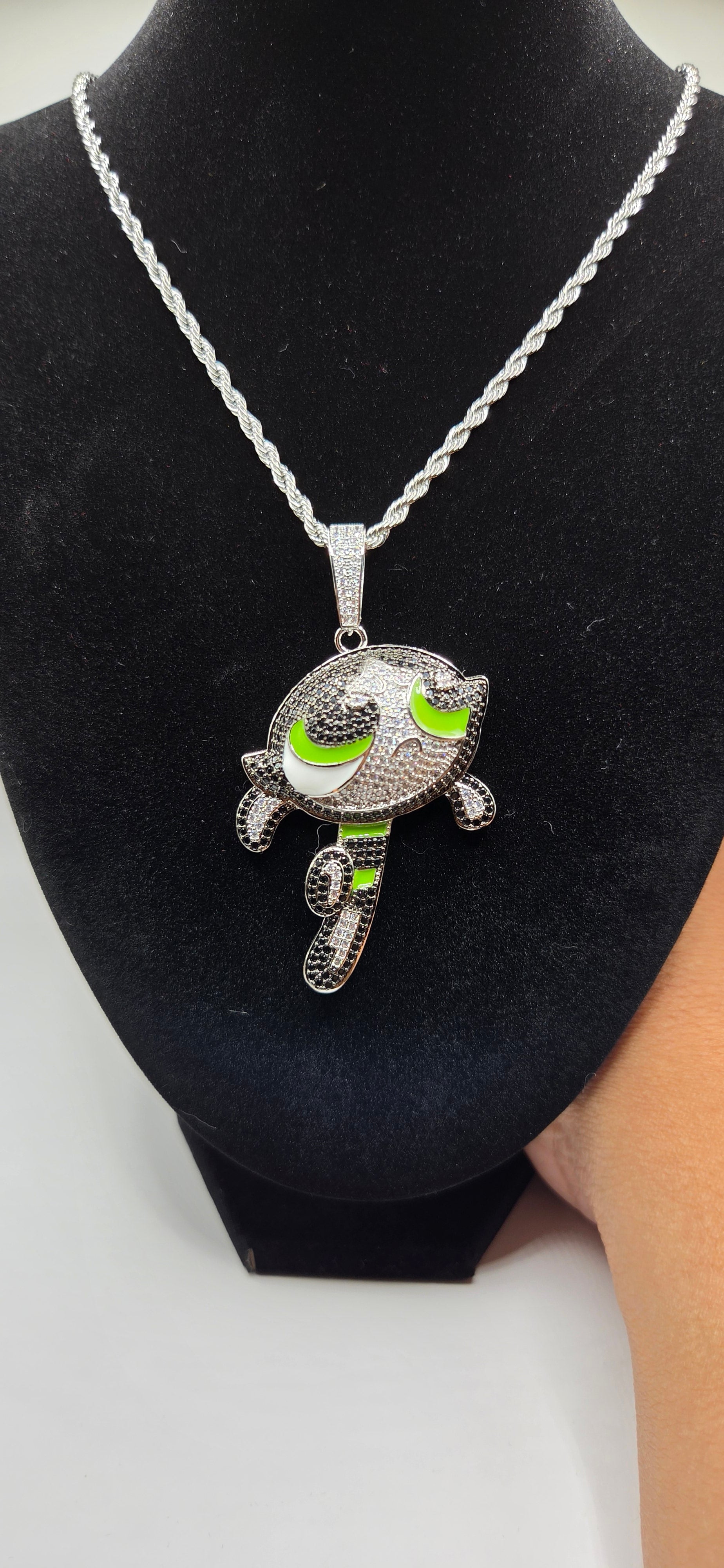 Iced out buttercup power puff girl pendant on a 24 inch rope chain.