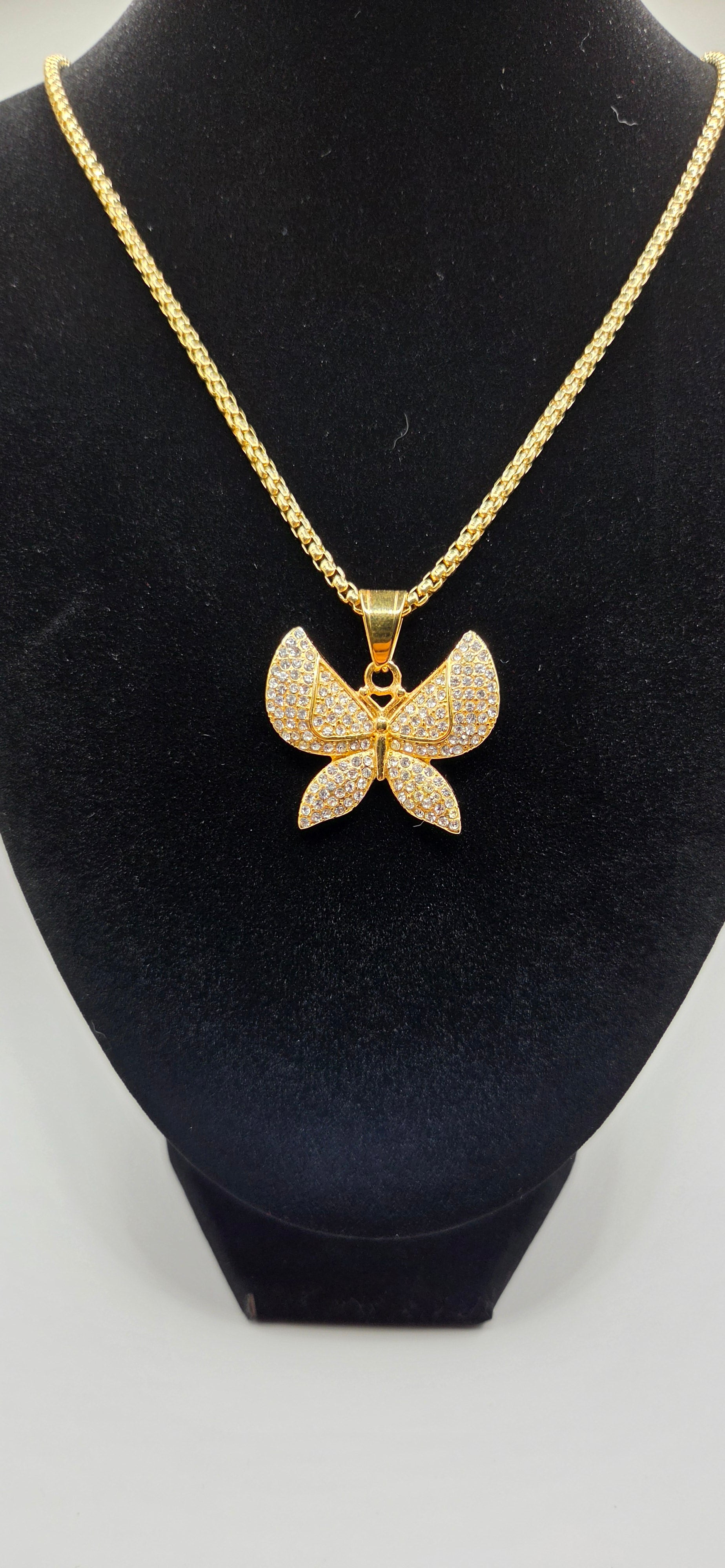 24 inch gold rope chain with a iced out butterfly pendant
