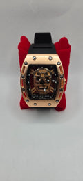 AJ Mille style skeleton watch rose gold with a black rubber band see through back