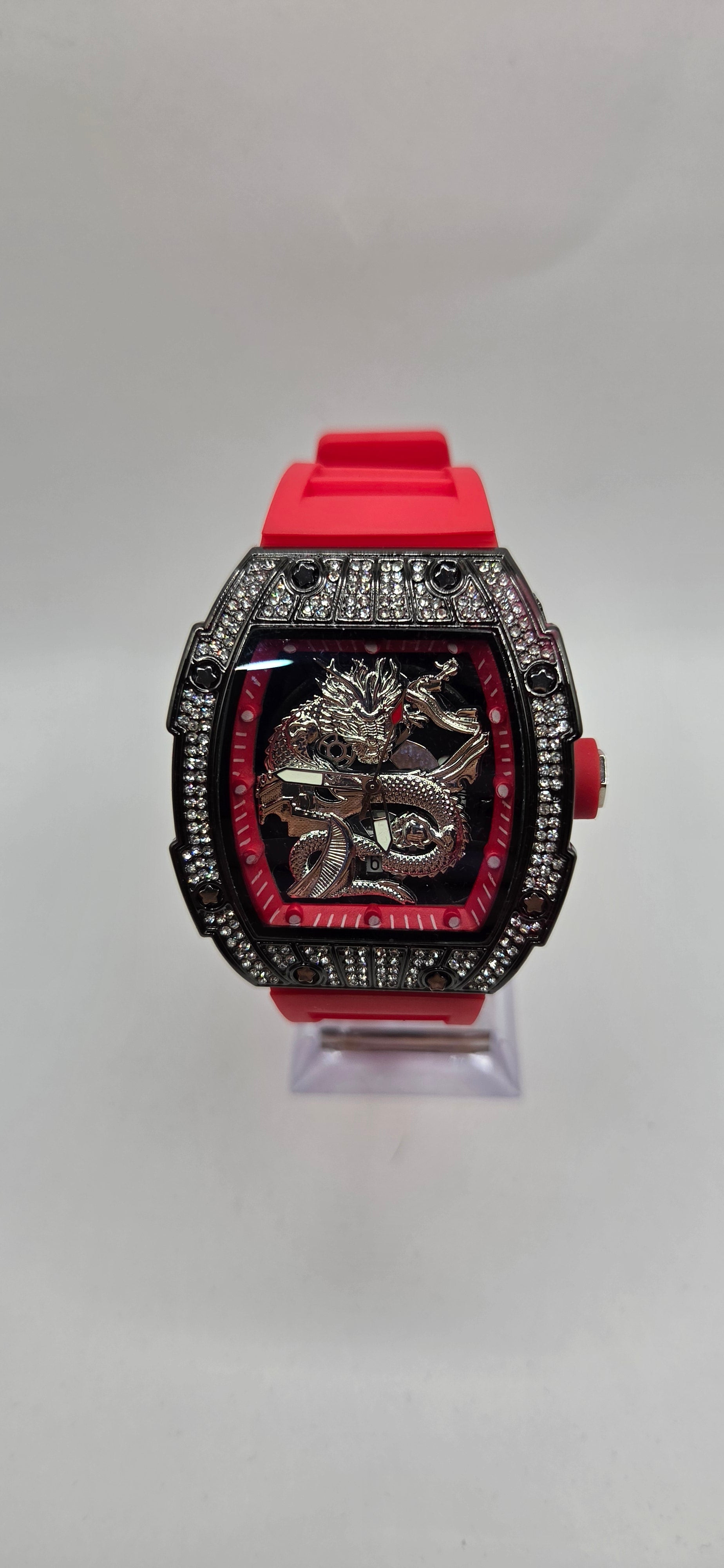 Aj iced out mille style watch with a red rubber band and VVSCZ stones