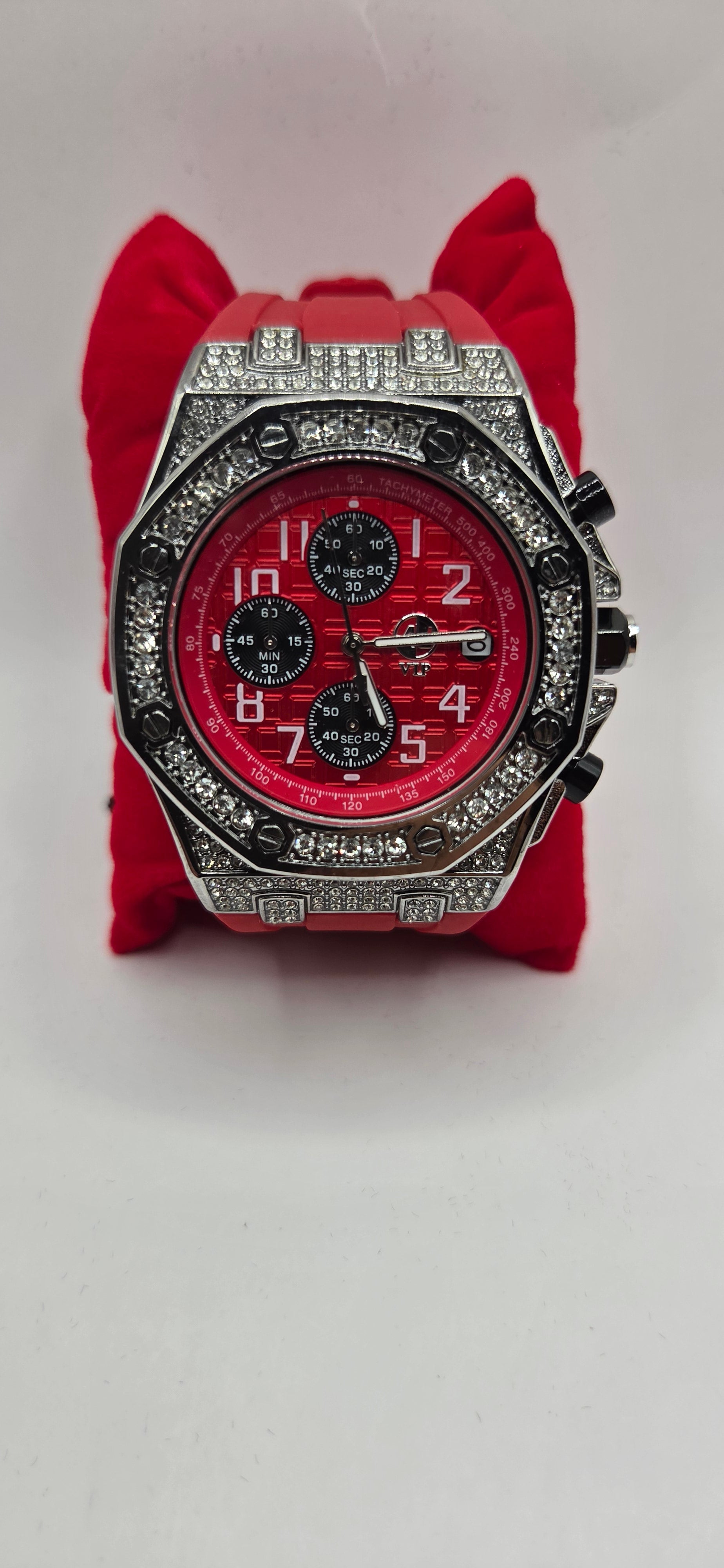 AJ red iced out Chrono master watch with a red rubber band