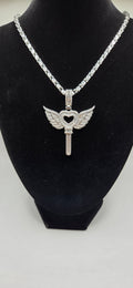 Iced out heart key with wings pendant with 24 inch silver/gold rope chain